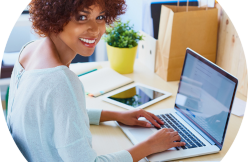 image for smiling woman using laptop